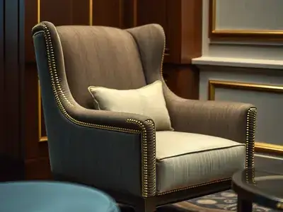 Medium shot of a hotel lobby chair with gold accent upholstery details, showing the elegant finished result